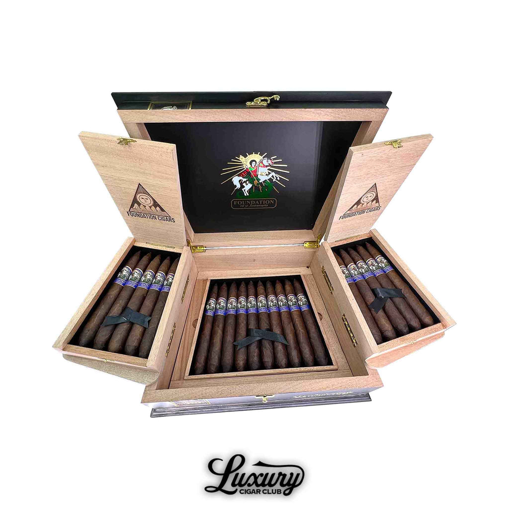 Open box of Foundation 10 Year Anniversario Salomon cigars by Luxury Cigar Club showing premium dark wrappers neatly arranged in rows