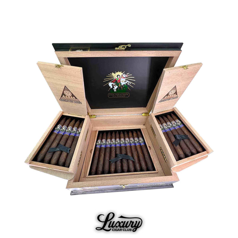 Open box of Foundation 10 Year Anniversario Salomon cigars by Luxury Cigar Club showing premium dark wrappers neatly arranged in rows