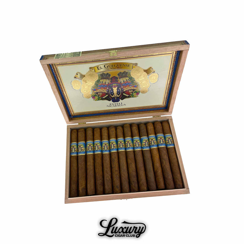 Open box of Foundation Cigars El Güegüense The Wise Man Corona Gorda from Luxury Cigar Club, showcasing 14 medium-brown cigars with blue and gold bands against colorful Nicaraguan-inspired artwork