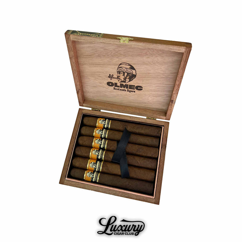 Open box of Foundation Cigars Olmec Claro Toro with six premium handmade cigars displayed inside, featuring golden San Andrés wrappers and the Olmec logo, available at Luxury Cigar Club