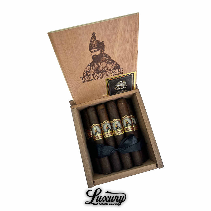 Open box of Foundation The Tabernacle Havana Seed No. 142 Robusto cigars with intricate bands and dark Connecticut wrapper, showcased by Luxury Cigar Club for premium cigar enthusiasts.