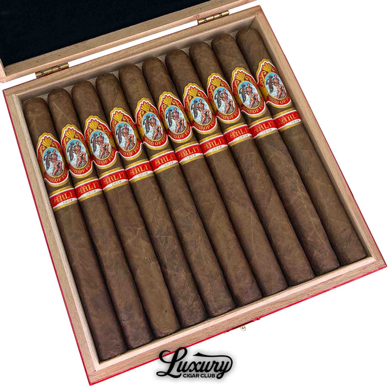 Close-up of God of Fire by Carlito Churchill cigars aged 3 years – premium long-format cigars by Arturo Fuente with smooth natural wrapper and red Carlito bands, sold by Luxury Cigar Club