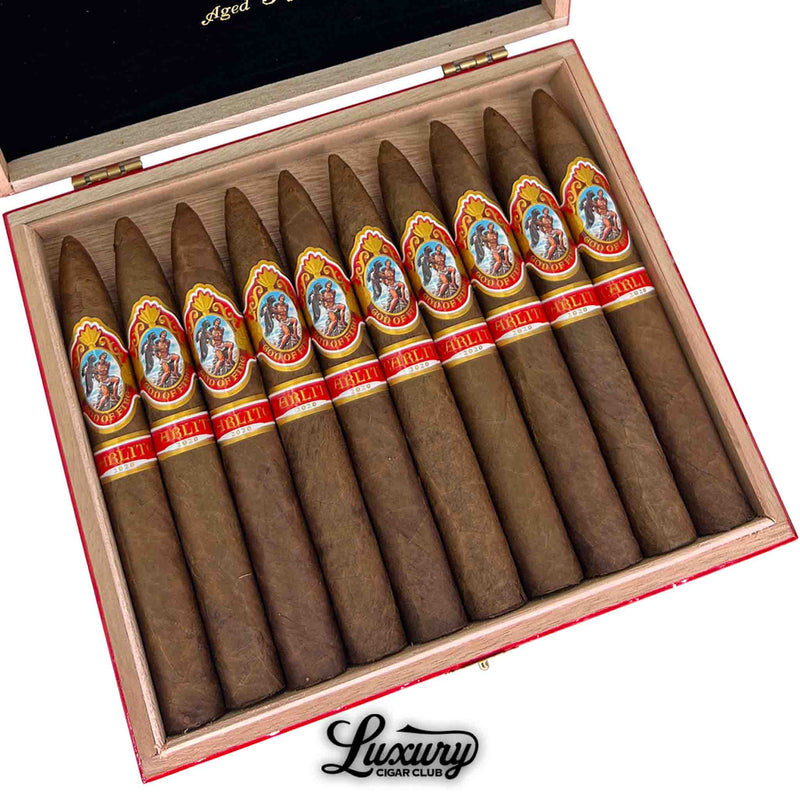 Close-up of God of Fire by Carlito Piramide 2020 cigars aged 3 years – artisanal tapered cigars by Arturo Fuente with elegant red Carlito bands, available at Luxury Cigar Club