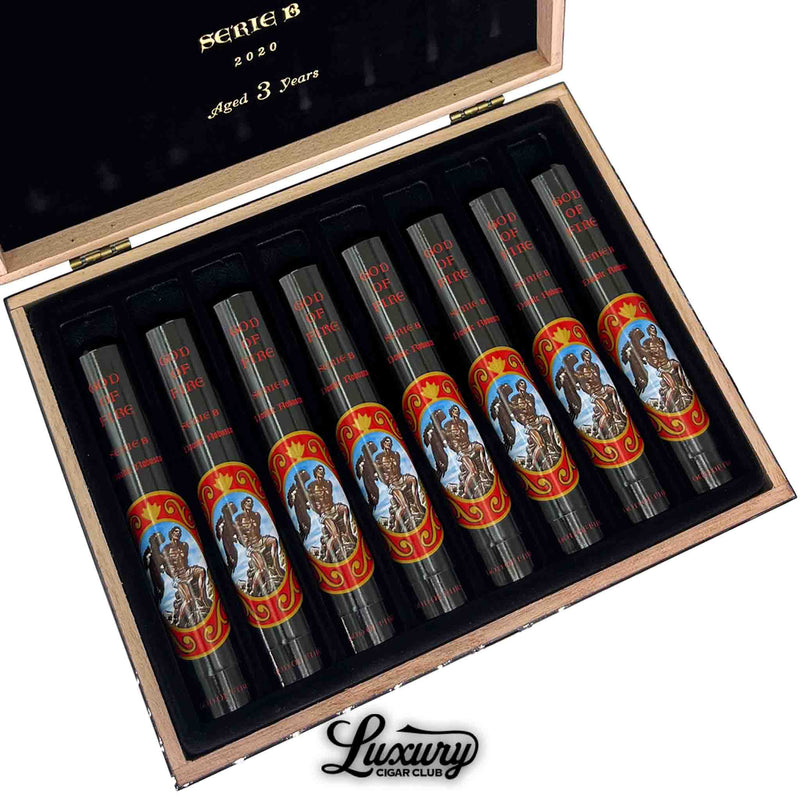 Close-up of God of Fire Serie B Double Robusto Tubo 2020 cigars aged 3 years – collectible black tubos with red and gold artwork by Arturo Fuente, featured by Luxury Cigar Club