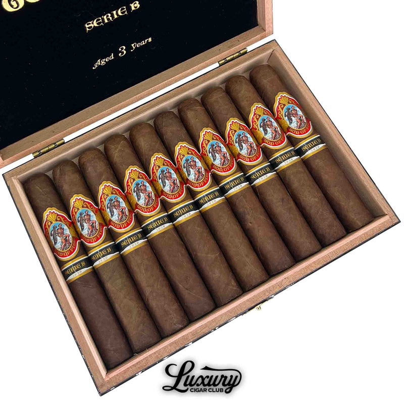 Open box of God of Fire Serie B Robusto Gordo 54 cigars aged 3 years – premium Arturo Fuente cigars with ornate red and gold bands, available at Luxury Cigar Club