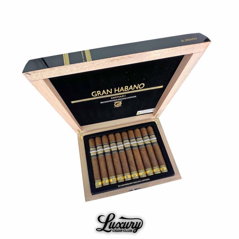 Gran Habano 20th Aniversario Capitulo I El Desafío box open with cigars displayed in rows, black interior and gold accents, Luxury Cigar Club