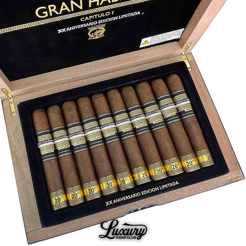 Close up of Gran Habano 20th Aniversario Capitulo I El Sueño cigars inside open box with black and gold bands, Luxury Cigar Club
