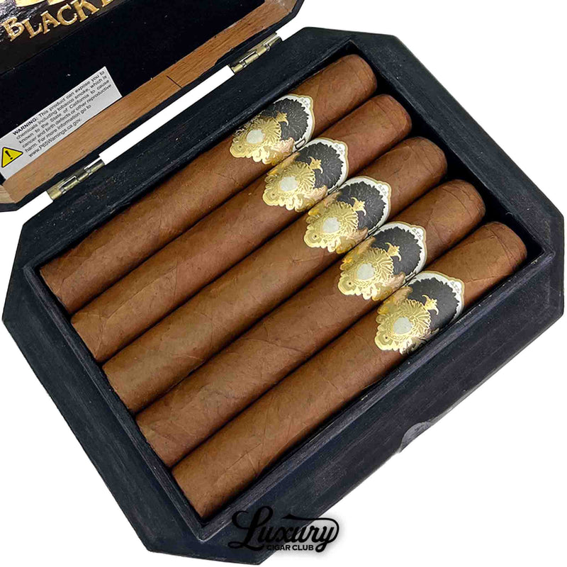 Close-up of Gran Habano Black Dahlia Gran Robusto cigars featuring gold and black bands from Luxury Cigar Club.