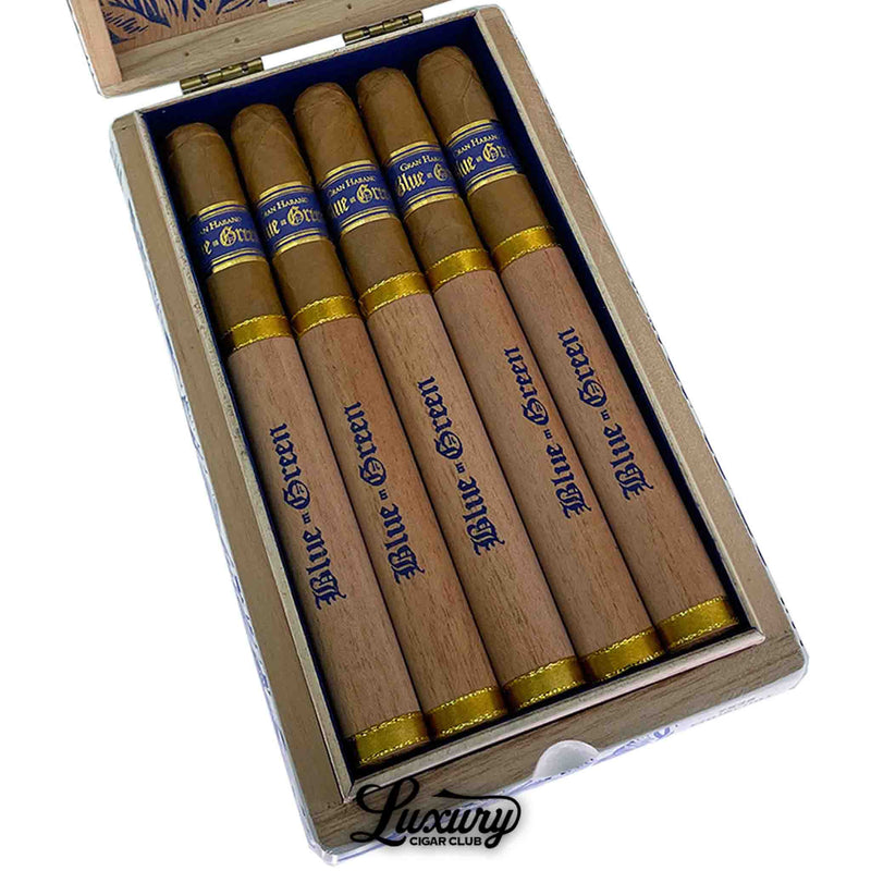 Close-up of Gran Habano Blue in Green Churchill cigars neatly arranged in a box with wooden covers and blue and gold cigar bands. Luxury Cigar Club logo beneath.