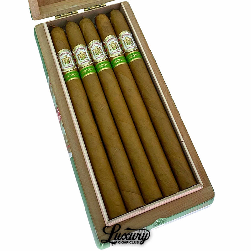 Close-up of Gran Habano Connecticut No. 1 Lancero cigars arranged neatly in an open wooden box, highlighting the smooth golden Connecticut wrappers and detailed green and gold cigar bands. Luxury Cigar Club logo beneath.