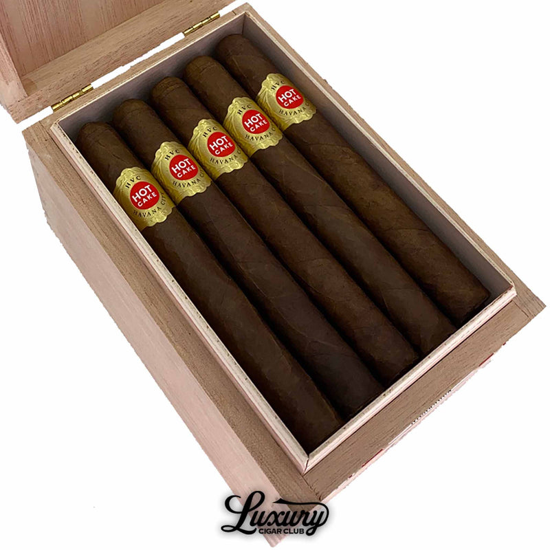 Close up of HVC Hot Cake Laguito No. 5 cigars with gold and red bands in box from Luxury Cigar Club