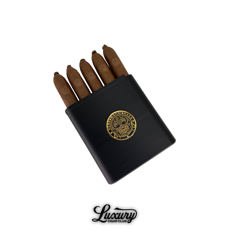 Henk Maori Gaudi cigars presented in a sleek black case with gold embossed logo, available at Luxury Cigar Club.