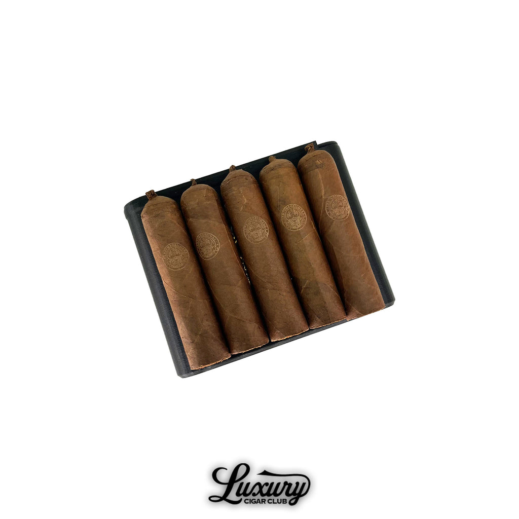 Henk Maori Gaudini cigars neatly arranged in an elegant black box with orange interior, offered by Luxury Cigar Club.