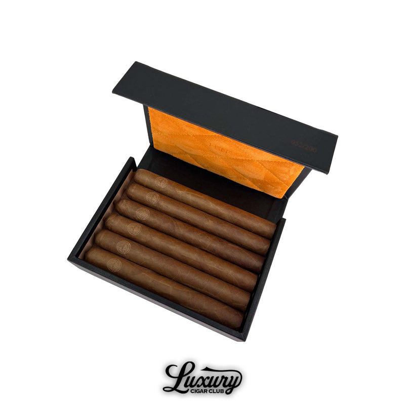Henk Maori La Doña cigars in a refined black case with gold Maori emblem, available through Luxury Cigar Club.