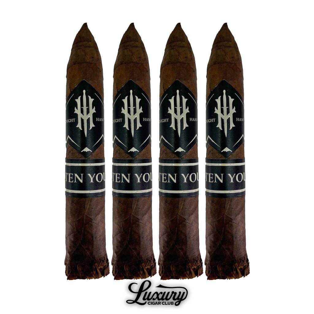 Four-pack of Hooten Young Midnight Hammer Limited Edition Torpedo cigars with dark brown wrappers and black bands, displayed upright with Luxury Cigar Club logo