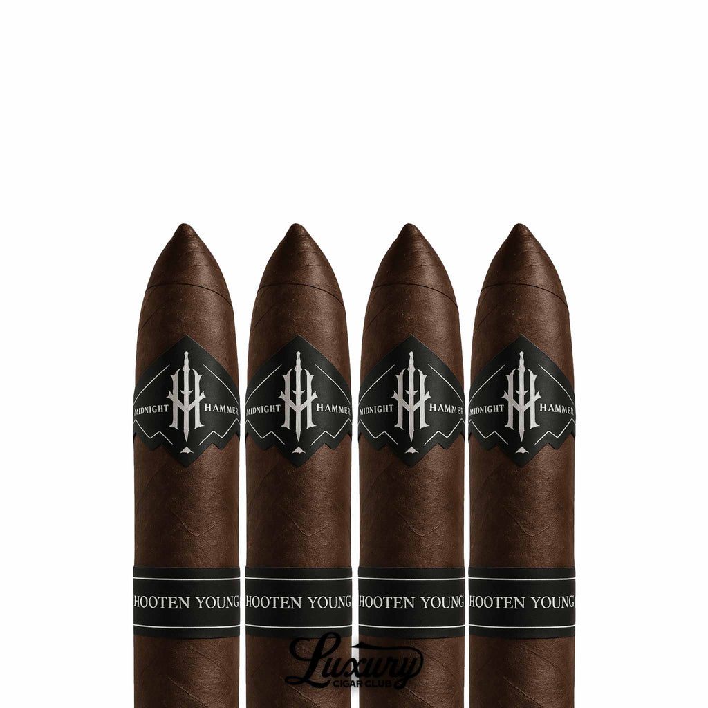 Close-up of four Hooten Young Midnight Hammer Torpedo Limited Edition cigars with dark maduro wrappers and black bands, displayed in a row on a white background for Luxury Cigar Club product listing