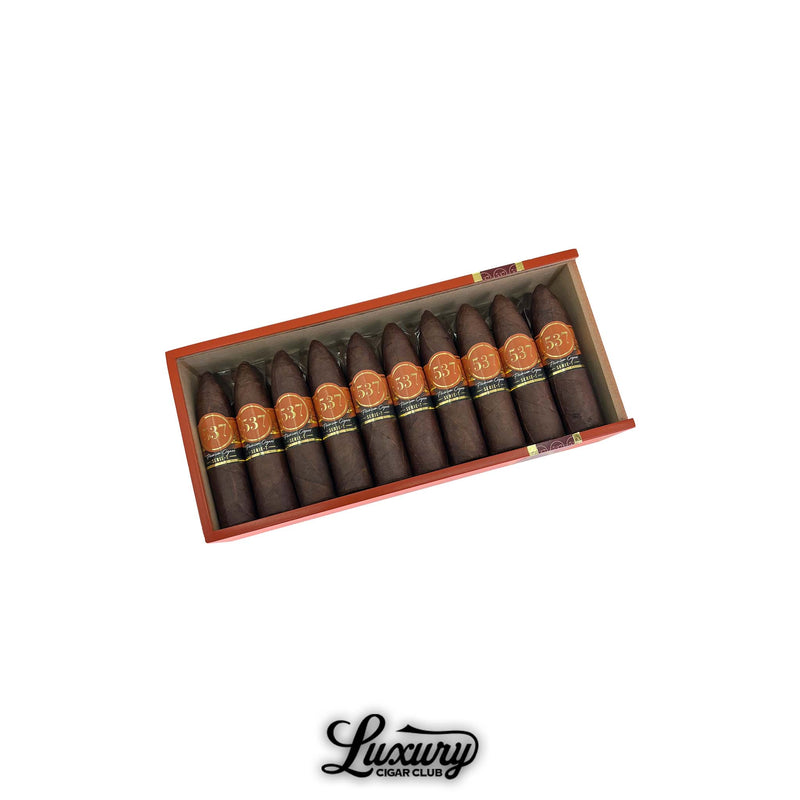 Box of IGM 537 Rockets cigars neatly lined up with pointed tips and orange bands, showcasing premium handmade cigars available at Luxury Cigar Club.