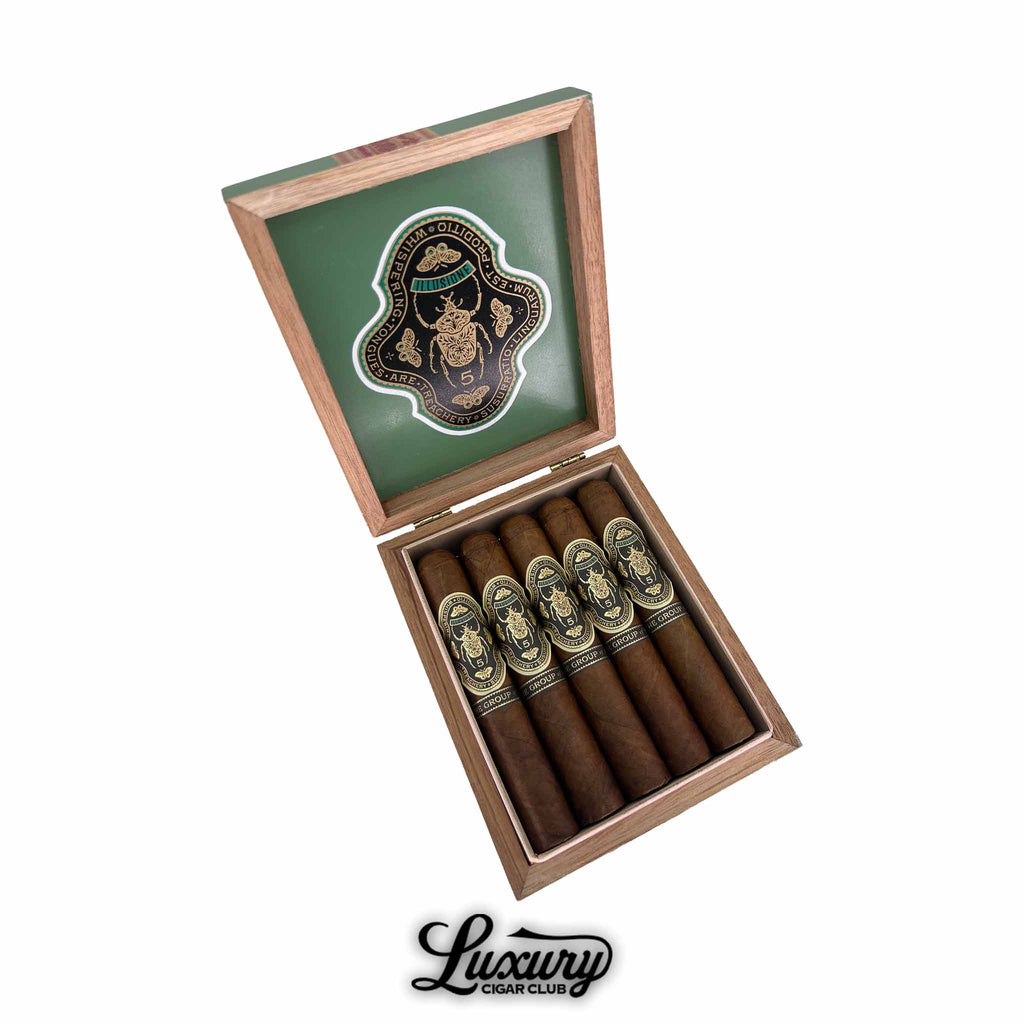 Illusione Group of Five Robusto cigars displayed in an elegant open wooden box with a green interior lid, featuring gold-accented bands and intricate emblematic detailing, presented by Luxury Cigar Club.