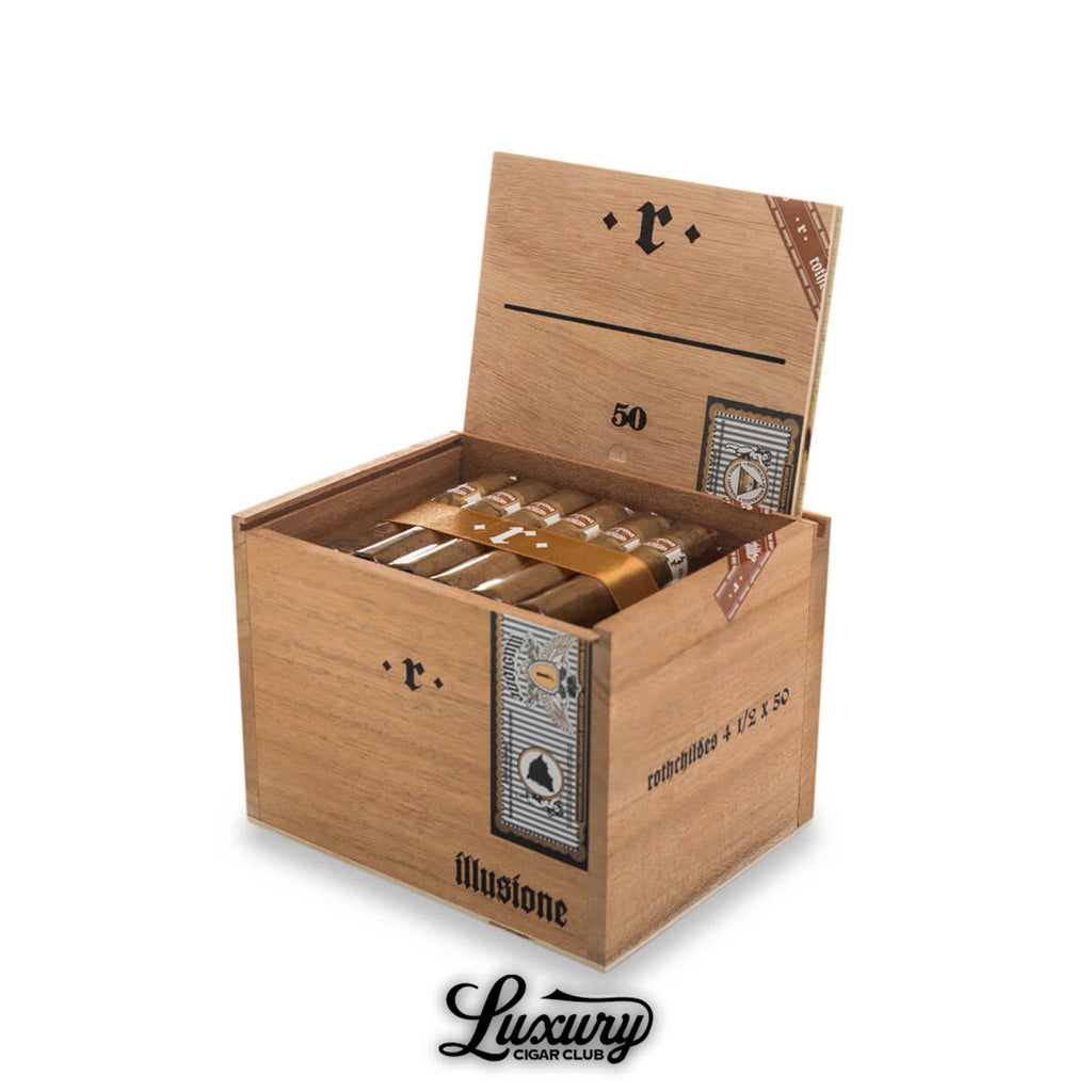 Open wooden box of Illusione Rothchildes Connecticut cigars arranged neatly inside, showing the elegant packaging with gold ribbon and minimalist black branding on the lid. Luxury Cigar Club logo displayed below.