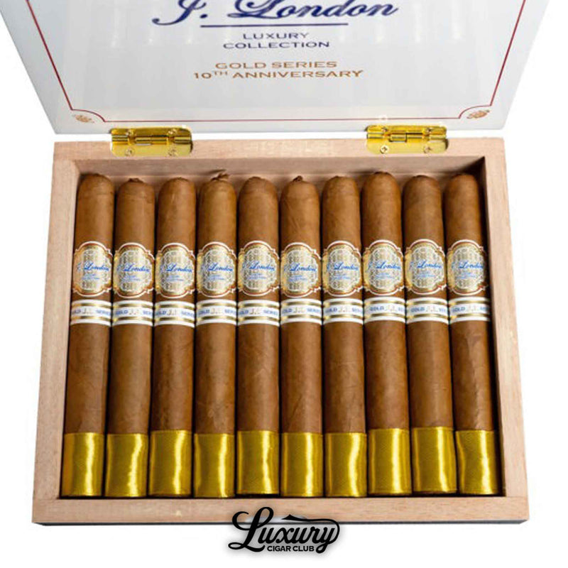 Close-up of J. London Gold Series 10th Anniversary Corona Gorda cigars in box with white and gold bands at Luxury Cigar Club