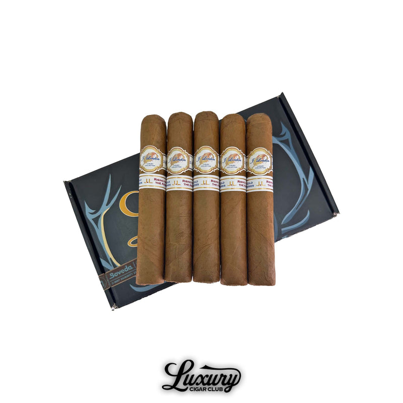 J London Gold Series Gordo Pre-Release cigars displayed in a 5-pack bundle, shown atop a black and blue Boveda humidified box, with Luxury Cigar Club branding below—premium long-filler cigars ideal for collectors and aficionados seeking exclusive pre-release blends.
