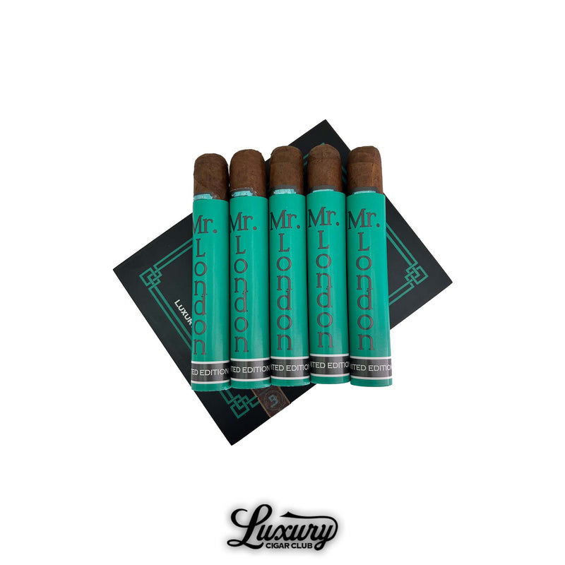 Limited edition J London Mr London Super Robusto cigars in teal aluminum tubes arranged over Luxury Cigar Club packaging