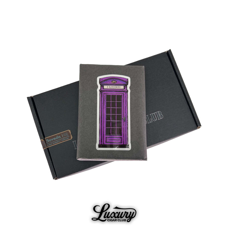 J London Telephone Booth Series Lavender Robusto cigars wrapped in gray paper with purple London phone booth art on top of Luxury Cigar Club black shipping box for sale online