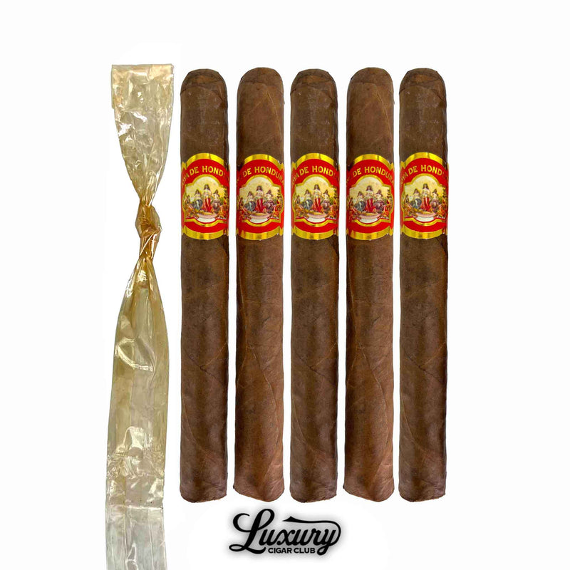Five-pack of Joya de Honduras Corona cigars from Luxury Cigar Club, featuring rich Honduran tobacco and elegant red-and-gold labels with included cellophane wrap.