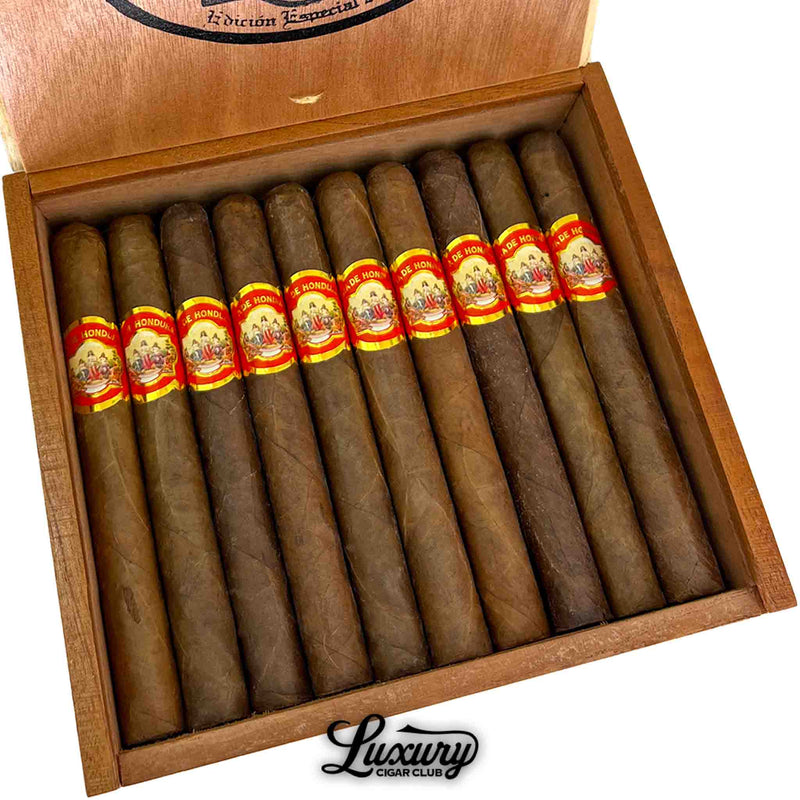 Close-up of Joya de Honduras Corona cigars from Luxury Cigar Club, highlighting smooth brown wrappers, vibrant red and gold bands, and classic Honduran craftsmanship.