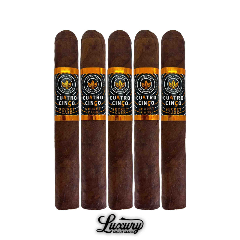 Five pack of Joya de Nicaragua Cuatro Cinco Secret Cask cigars from Luxury Cigar Club standing upright with orange and black bands.