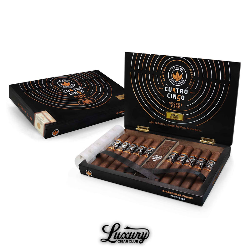 Open black and gold box of Joya de Nicaragua Cuatro Cinco Secret Cask Toro BP cigars displayed at Luxury Cigar Club on a white background.