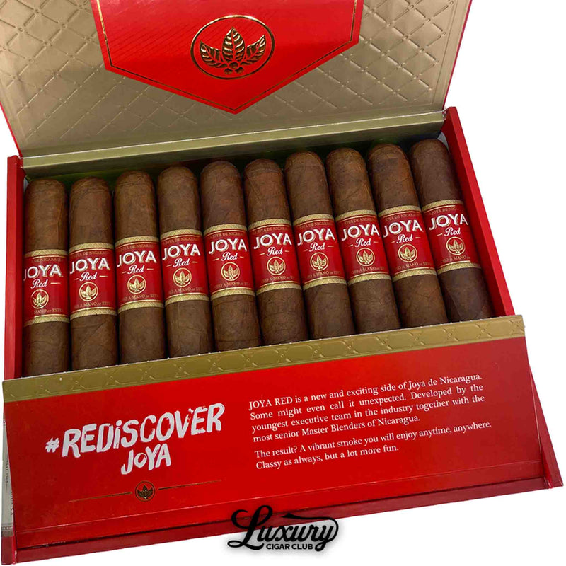 Close-up shot of Joya de Nicaragua Joya Red Toro cigars inside the open red and gold box, highlighting the red JOYA bands and #RediscoverJoya branding on the inside lip of the box for Luxury Cigar Club.