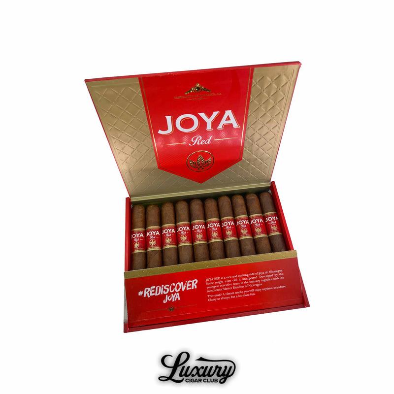Joya de Nicaragua Joya Red Toro cigars displayed in an open red and gold box, showing a full row of Toro cigars with red JOYA bands, photographed for Luxury Cigar Club.