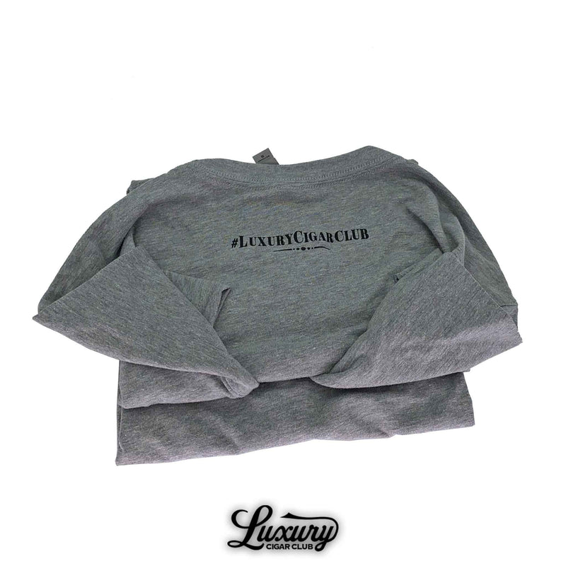Luxury Cigar Club Atabey T-shirt folded to show the back with the hashtag LuxuryCigarClub in black text.