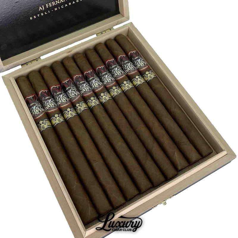 Close-up of an open box of Viva La Vida Lancero cigars by AJ Fernandez, featuring detailed dual bands and rich brown wrappers.