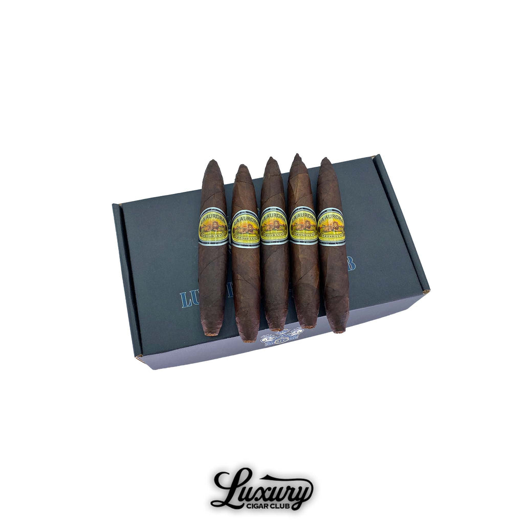 La Aurora Preferido No. 1 Black Broadleaf Perfecto cigars displayed on a Luxury Cigar Club box, showcasing the dark broadleaf wrapper, perfecto shape, and traditional La Aurora band art, premium Dominican cigars online