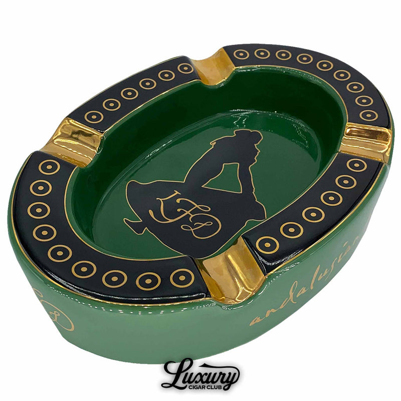 Close-up of the La Flor Dominicana Andalusian Bull ashtray in green, black, and gold, offered by Luxury Cigar Club.