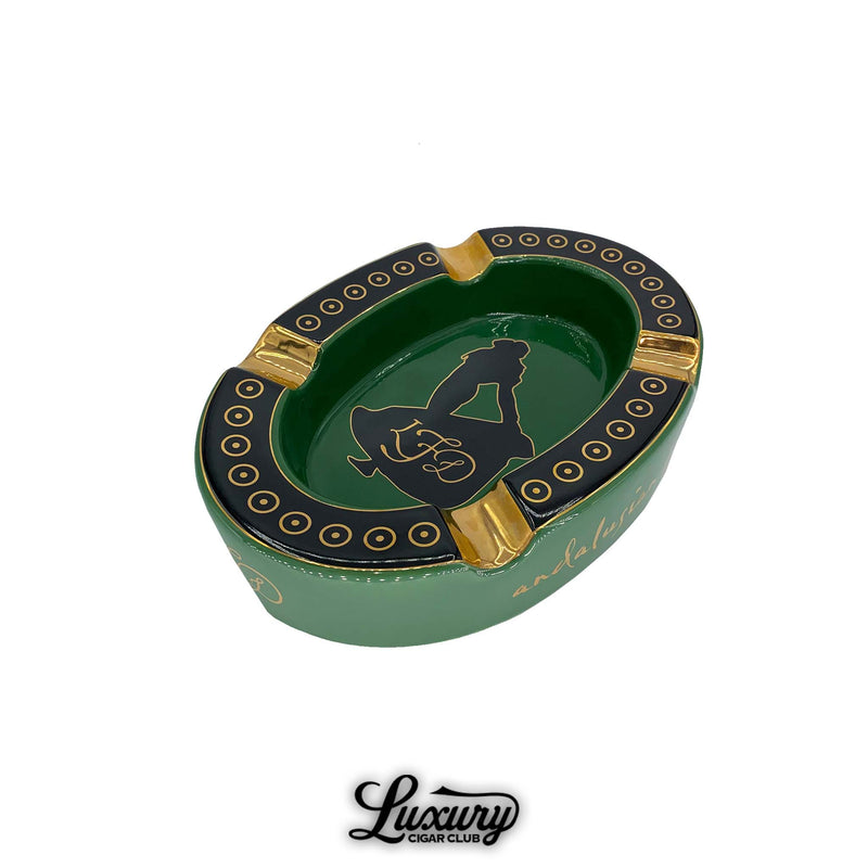 Green and black oval La Flor Dominicana Andalusian Bull ashtray with gold accents and logo, available at Luxury Cigar Club.