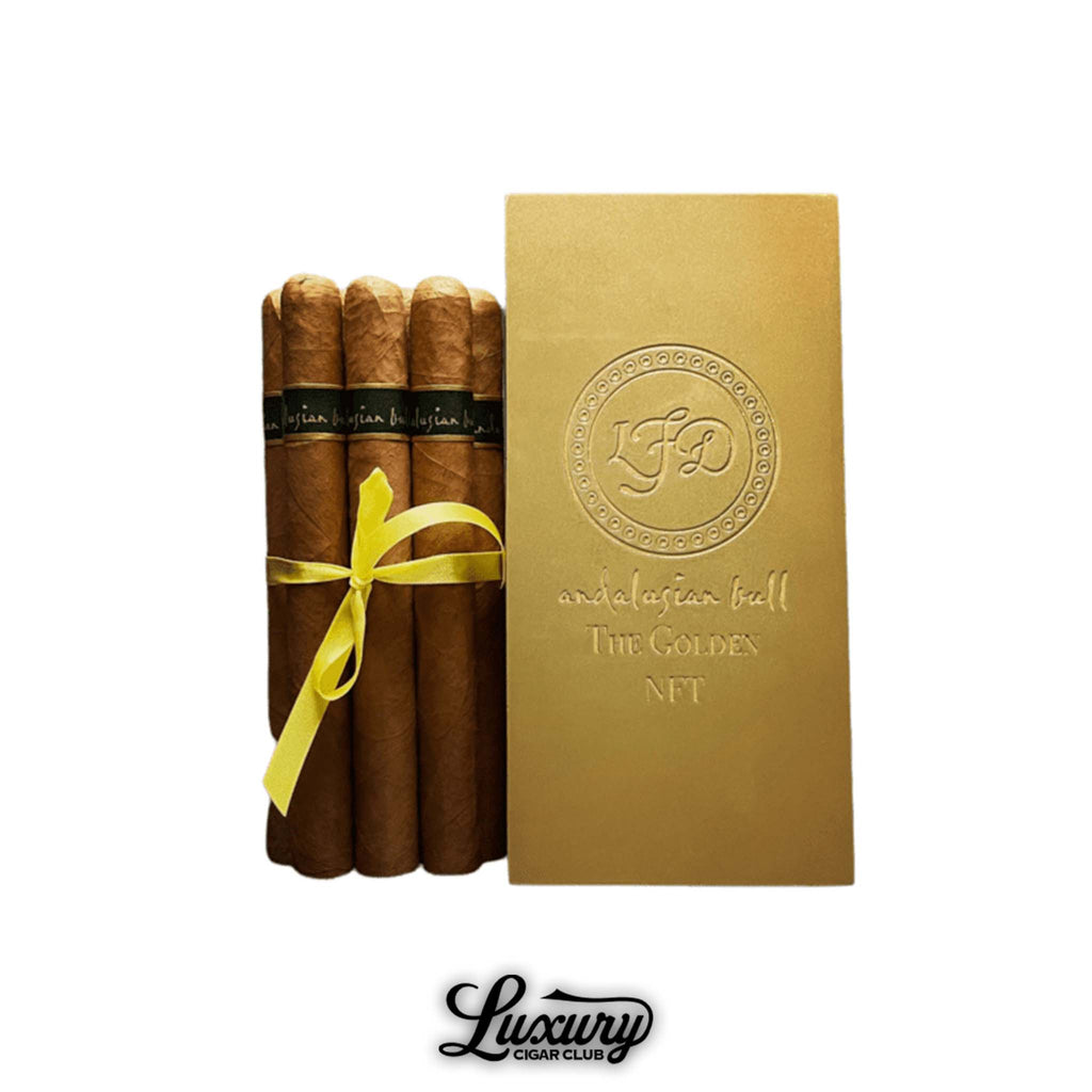 La Flor Dominicana Andalusian Bull The Golden NFT Lonsdale cigars paired with an embossed golden presentation box and yellow ribbon, available at Luxury Cigar Club.