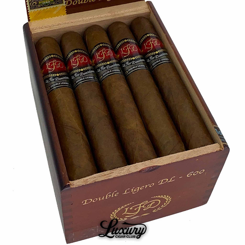 Close-up of La Flor Dominicana Double Ligero Natural DL-600 cigars displaying the signature red and black bands, presented by Luxury Cigar Club.