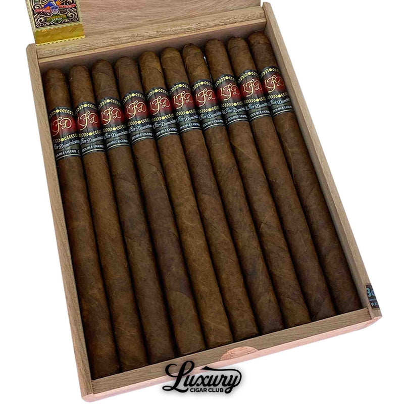Detailed close-up of La Flor Dominicana Double Ligero Natural Lancero cigars inside box, showing expert craftsmanship and fine wrapper texture, from Luxury Cigar Club.