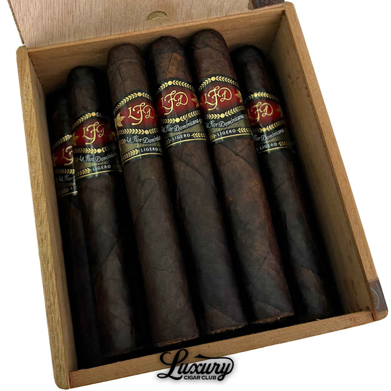 Detailed close up of La Flor Dominicana Ligero Oscuro Natural L-400 cigars inside an open box showcasing dark oily wrappers by Luxury Cigar Club.