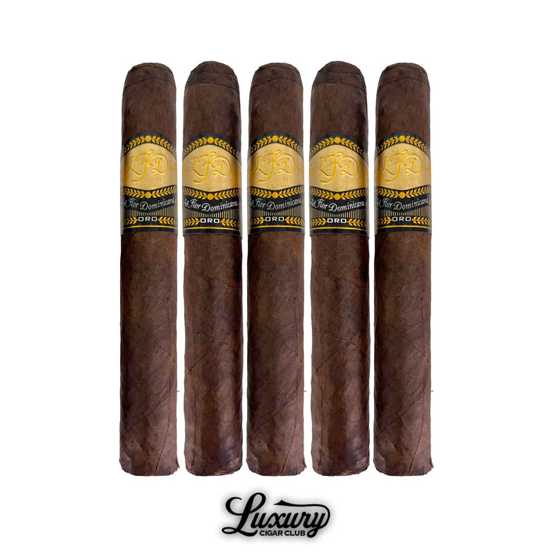 Luxury Cigar Club La Flor Dominicana Oro Maduro No 6 five pack featuring dark wrapped cigars with gold and black Oro bands lined up against a white background.