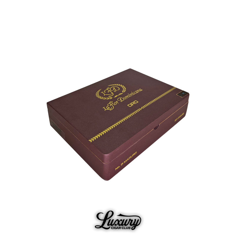 Luxury Cigar Club La Flor Dominicana Oro Maduro No 6 closed cigar box in deep burgundy with gold embossed branding and elegant Oro detailing.