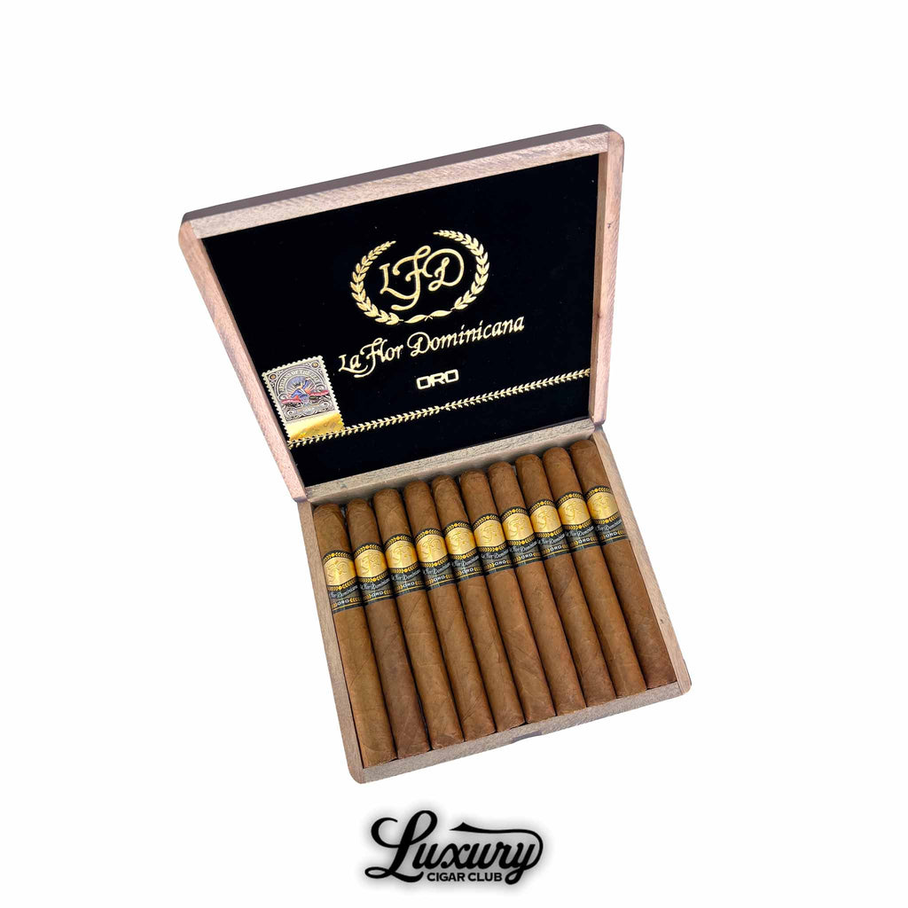 La Flor Dominicana Oro Natural No 5 cigars arranged in an open wooden box with black velvet interior and gold LFD Oro branding from Luxury Cigar Club