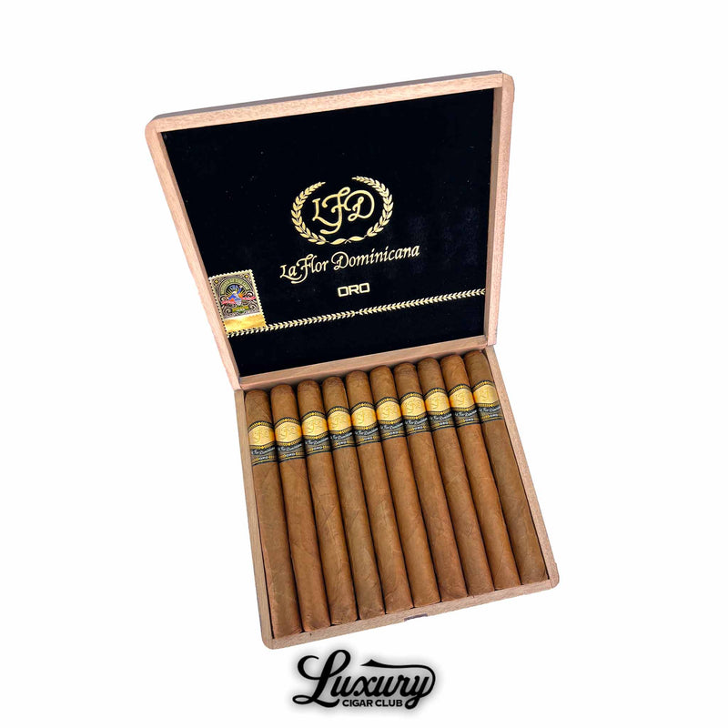 La Flor Dominicana Oro Natural No 7 cigars displayed in an open box with black velvet lid and gold embossed LFD logo from Luxury Cigar Club