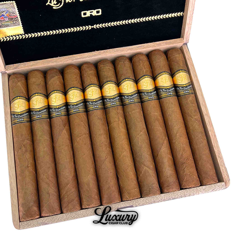 Close up of La Flor Dominicana Oro Natural No 8 cigars neatly arranged in their box showing gold and black Oro bands from Luxury Cigar Club