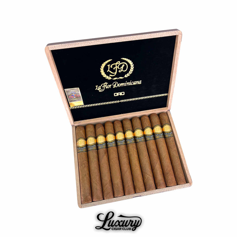 La Flor Dominicana Oro Natural No 8 cigars displayed in an open wooden box with black velvet lining and gold LFD branding from Luxury Cigar Club