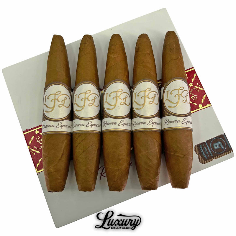 A five-pack of La Flor Dominicana Reserva Especial El Jocko cigars displayed over the box lid, highlighting the brand’s refined presentation, available at Luxury Cigar Club.