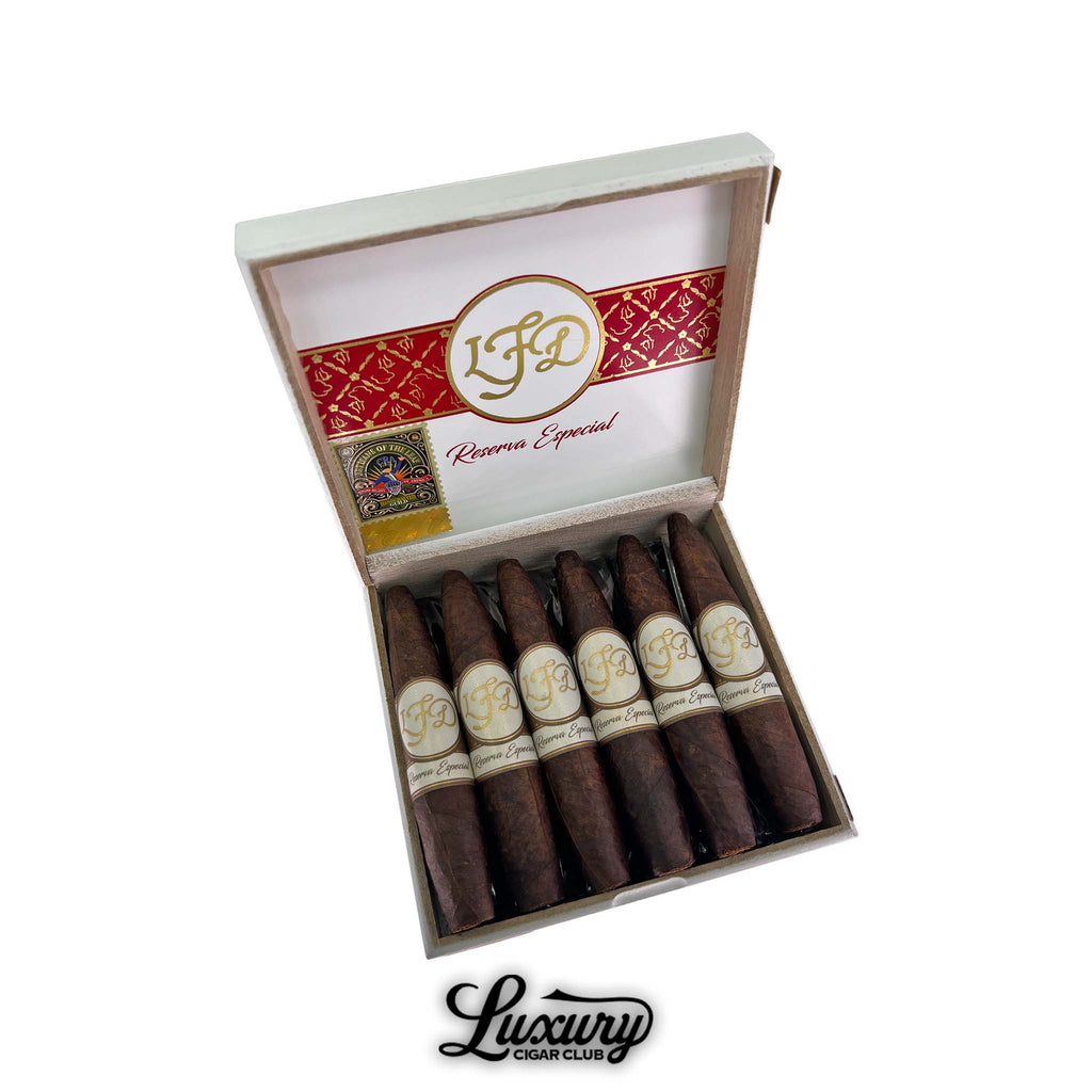 La Flor Dominicana Reserva Especial Maduro El Jocko cigars showcased in their elegant white and red box, featuring the signature LFD gold-embossed branding, available at Luxury Cigar Club.